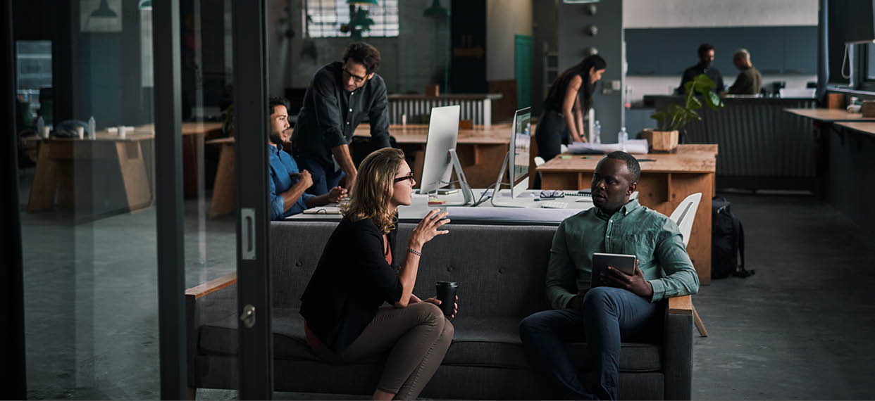 Shot of a group of businesspeople working together in a modern office